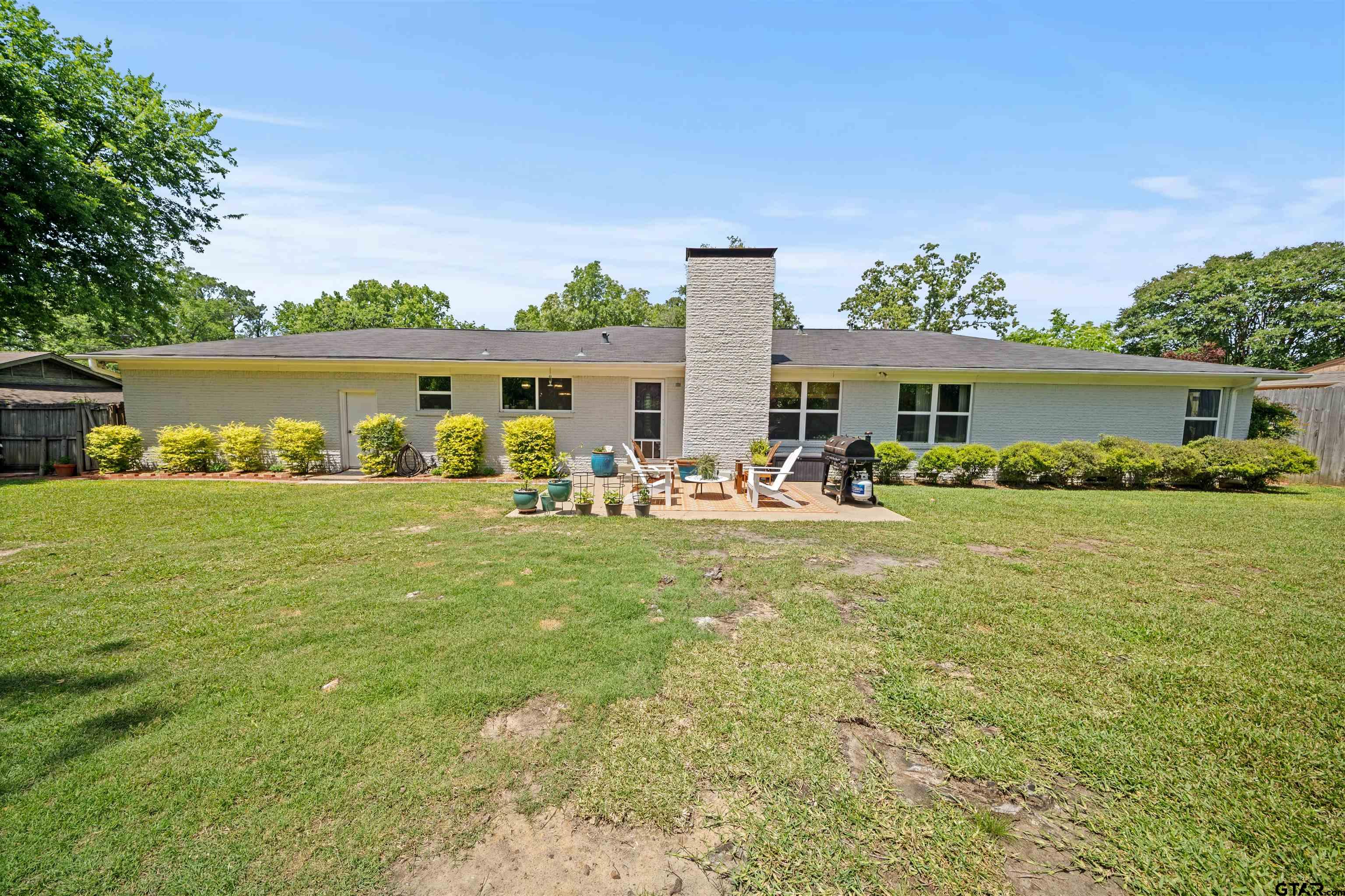 917 Rhodes Drive Tyler, TX 75701 - Photo 24 of 27 a front view of a house with garden