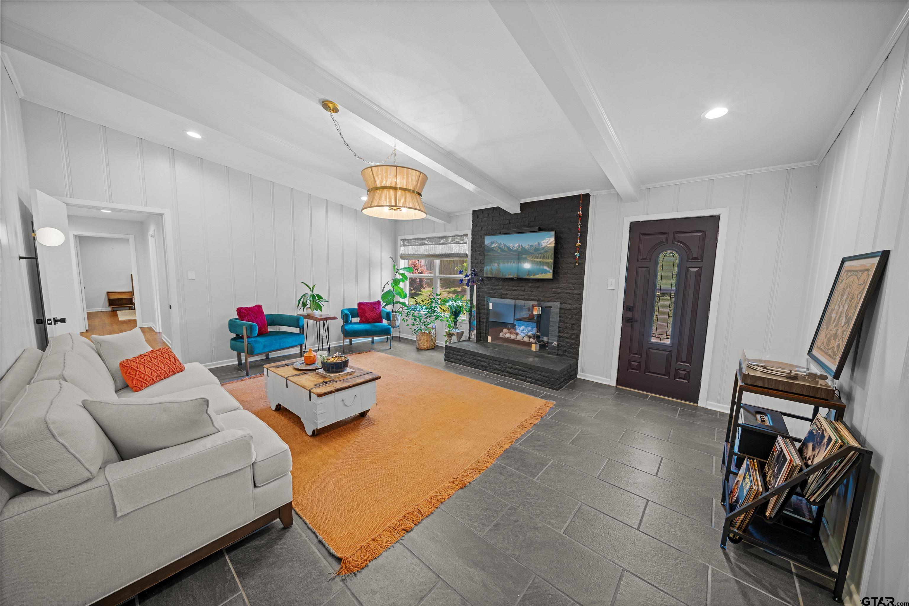 917 Rhodes Drive Tyler, TX 75701 - Photo 5 of 27 a living room with furniture and a flat screen tv