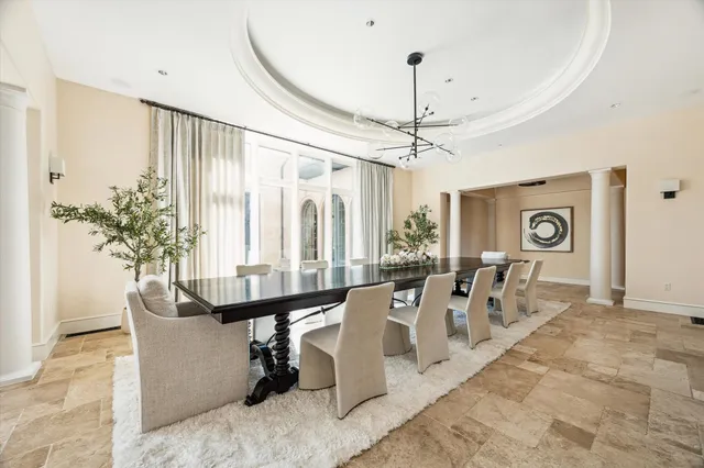 a view of a hallway with paintings on the walls