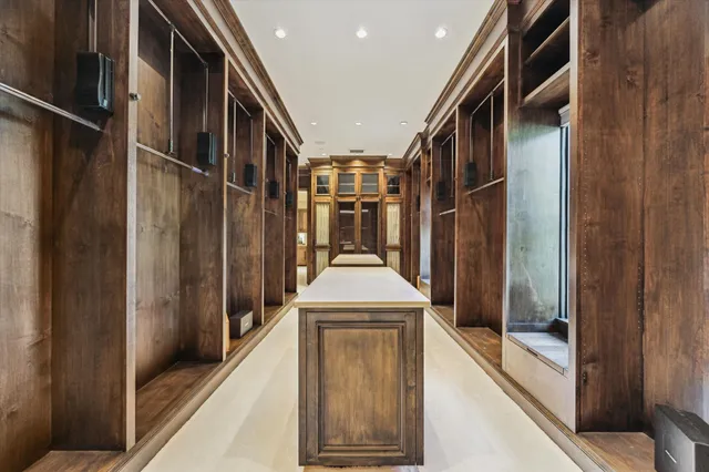 a kitchen with stainless steel appliances granite countertop a sink a stove and wooden floor