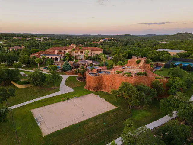 an aerial view of residential building and lake