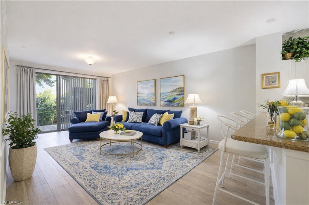 10049 Heather Lane, Unit 101 Naples, FL 34119 - Photo 3 of 28 Digitally staged living room