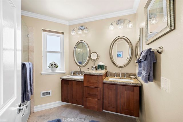 a bathroom with a toilet and a mirror