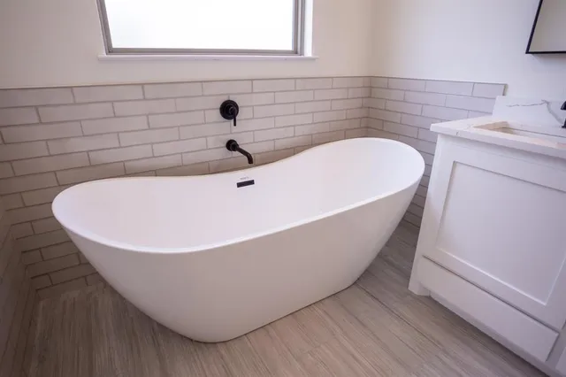 a bathroom with a sink and a bathtub
