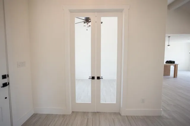 a kitchen with kitchen island a sink stainless steel appliances and cabinets