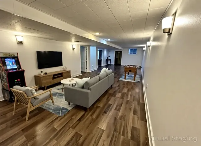 a living room with furniture and a flat screen tv