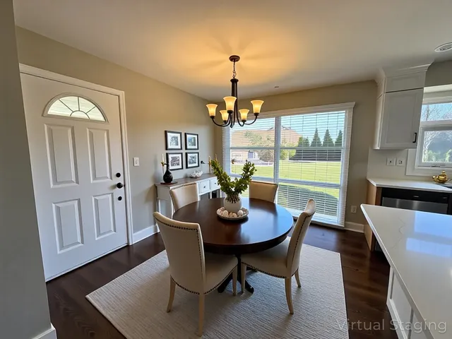 a view of a dining room with furniture window and wooden floor