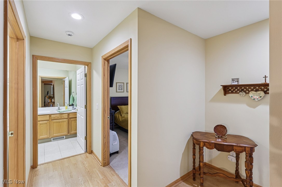 6894 Paradise Way North Ridgeville, OH 44039 - Photo 23 of 36 Hallway to primary bed and bathroom.