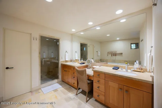 a room with a sink and a mirror