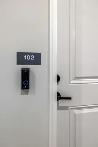 a bathroom with a shower and a glass door
