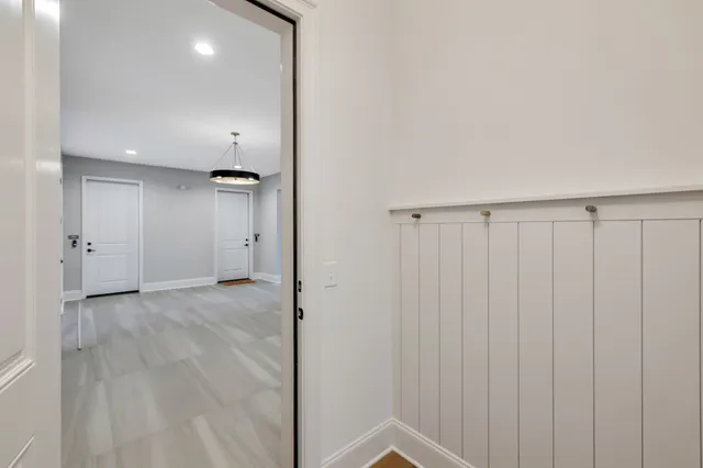 a view of wooden floor and chandelier in a room