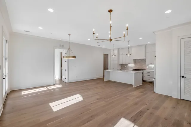 wooden floor with white walls