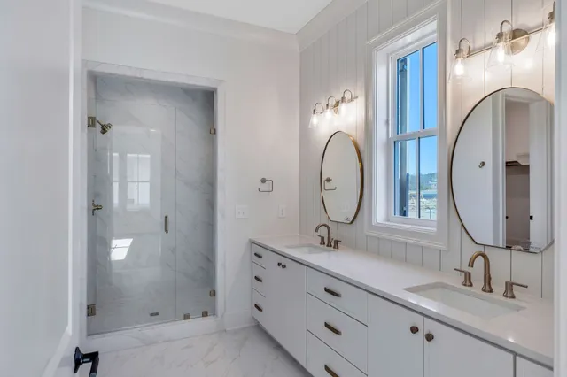 a bathroom with a glass shower door