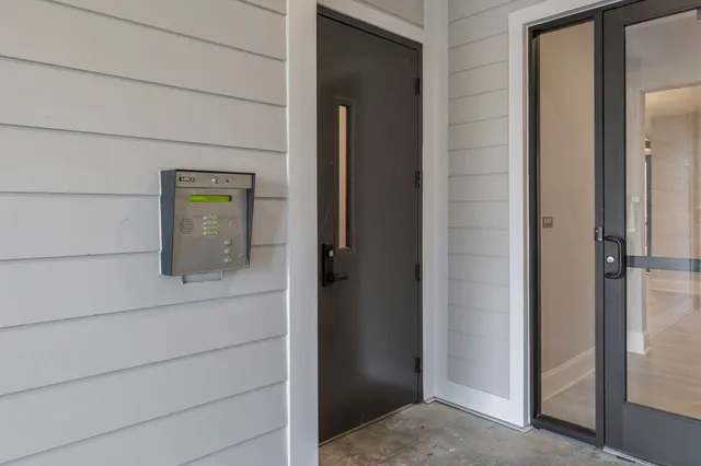 a bathroom with a shower and mirror