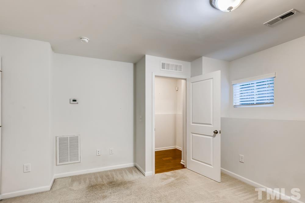 1625 Crafton Way Raleigh, NC 27607 - Photo 22 of 28 a view of a room with a hallway