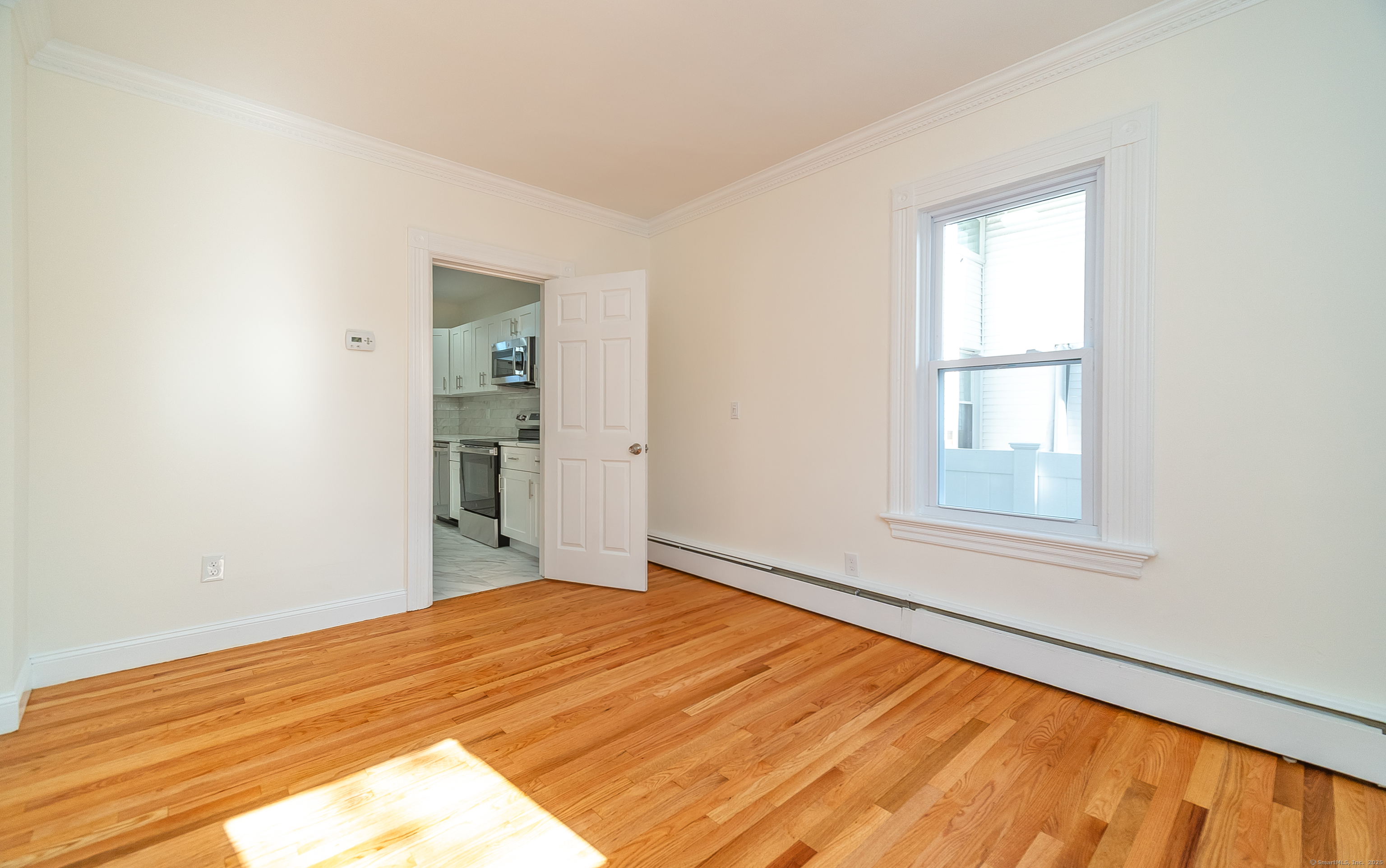 78 Warren Street Stamford, CT 06902 - Photo 14 of 40 a view of empty room with wooden floor