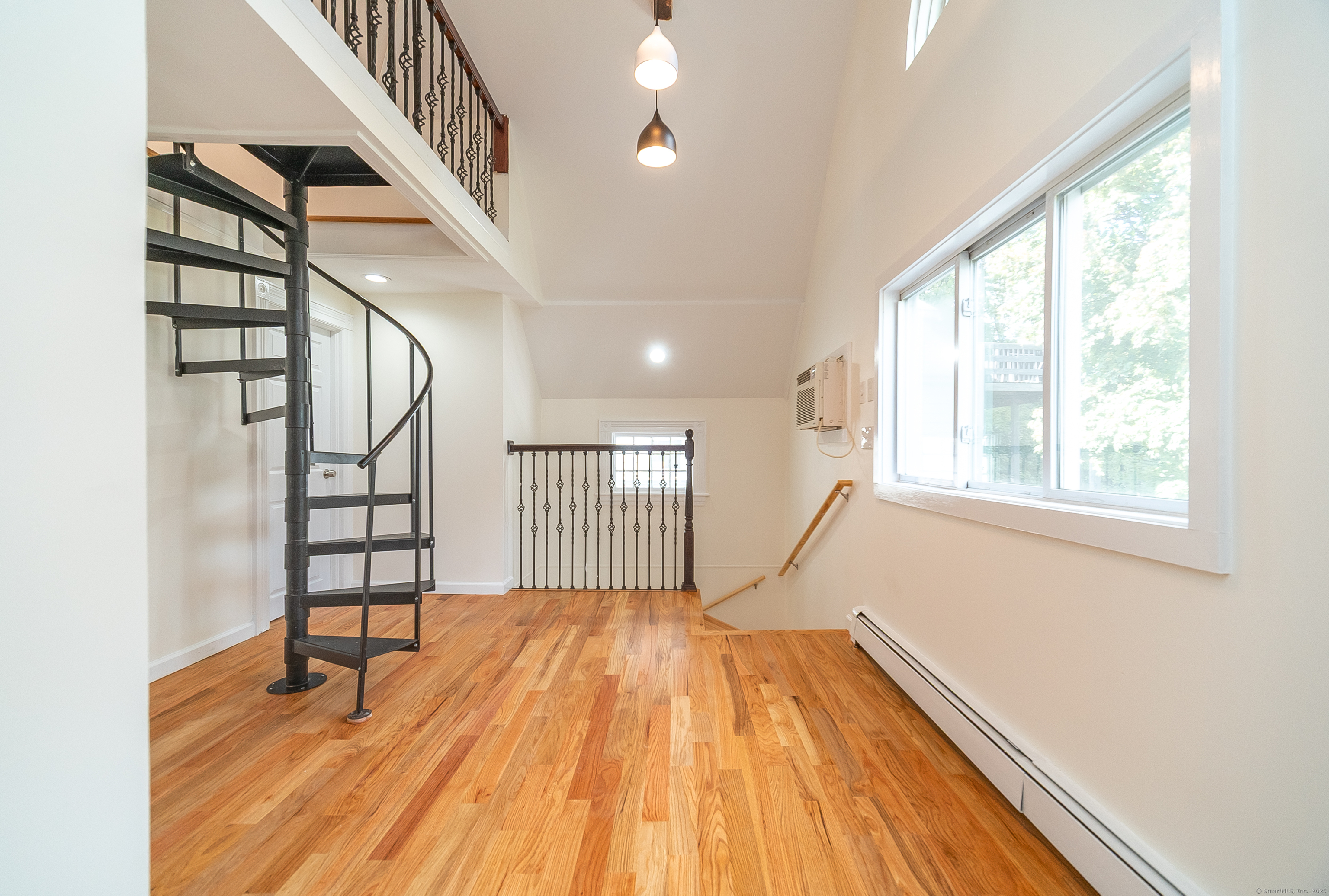 78 Warren Street Stamford, CT 06902 - Photo 18 of 40 a view of entryway with stairs and wooden floor