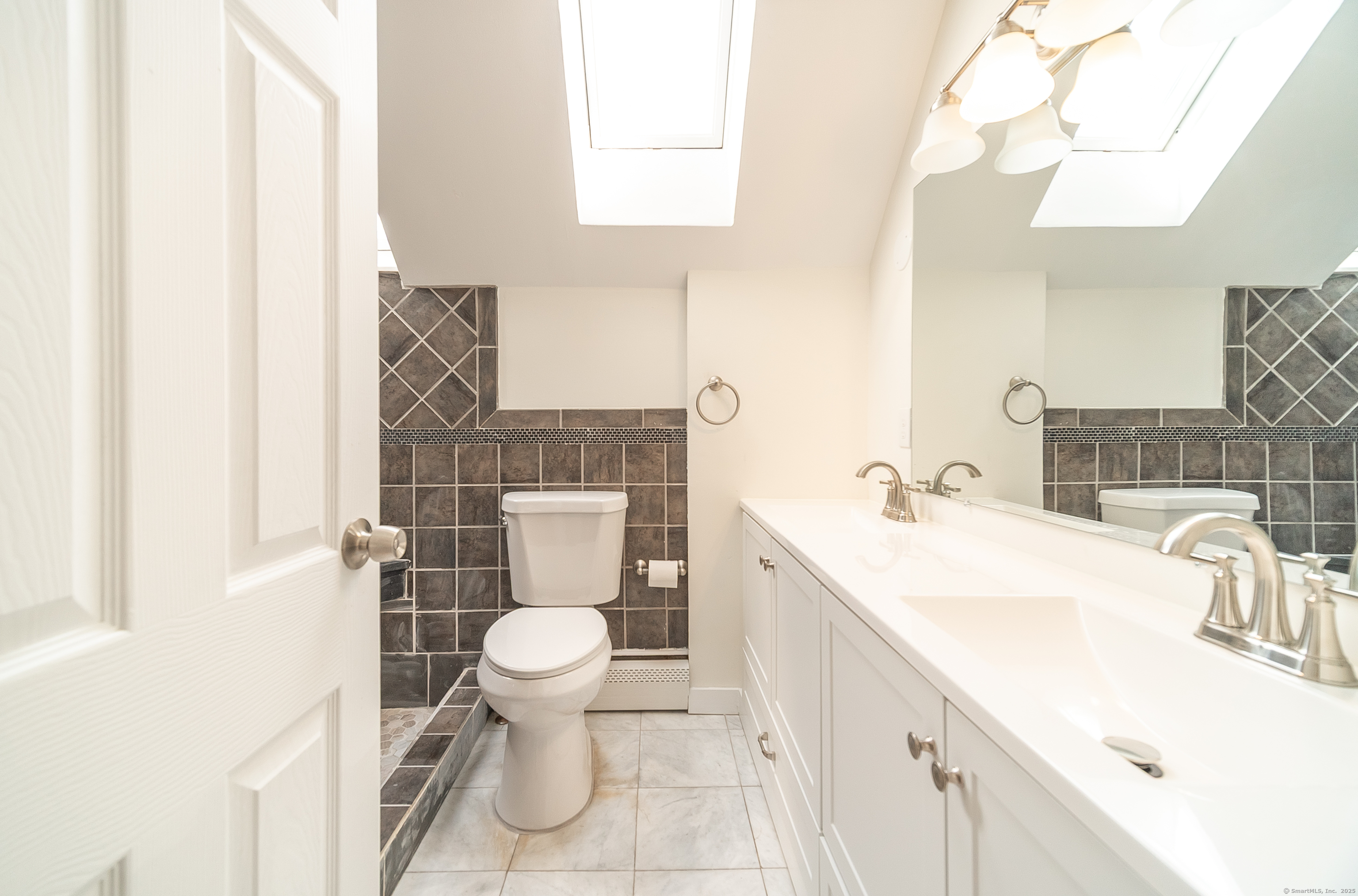 78 Warren Street Stamford, CT 06902 - Photo 23 of 40 a bathroom with a sink toilet and shower