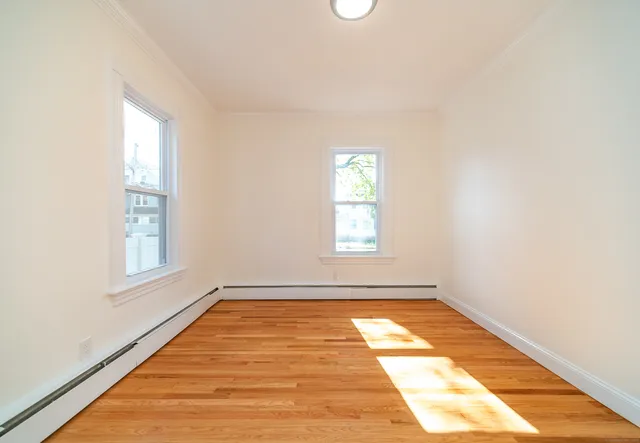a view of empty room with windows