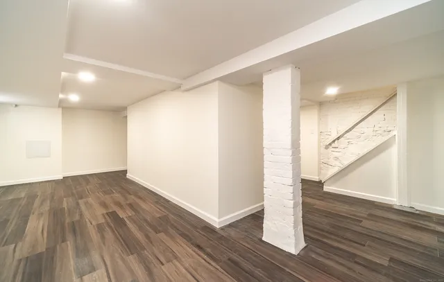 a view of hallway with wooden floor
