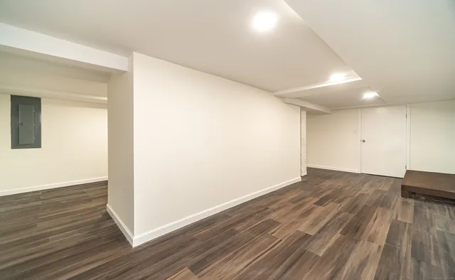 an empty room with wooden floor