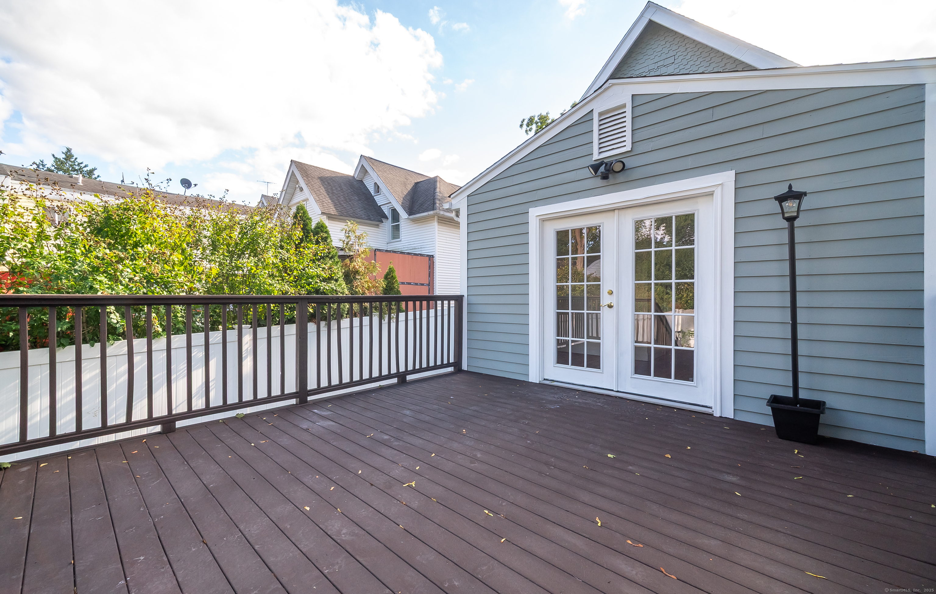 78 Warren Street Stamford, CT 06902 - Photo 34 of 40 a view of a house with wooden deck