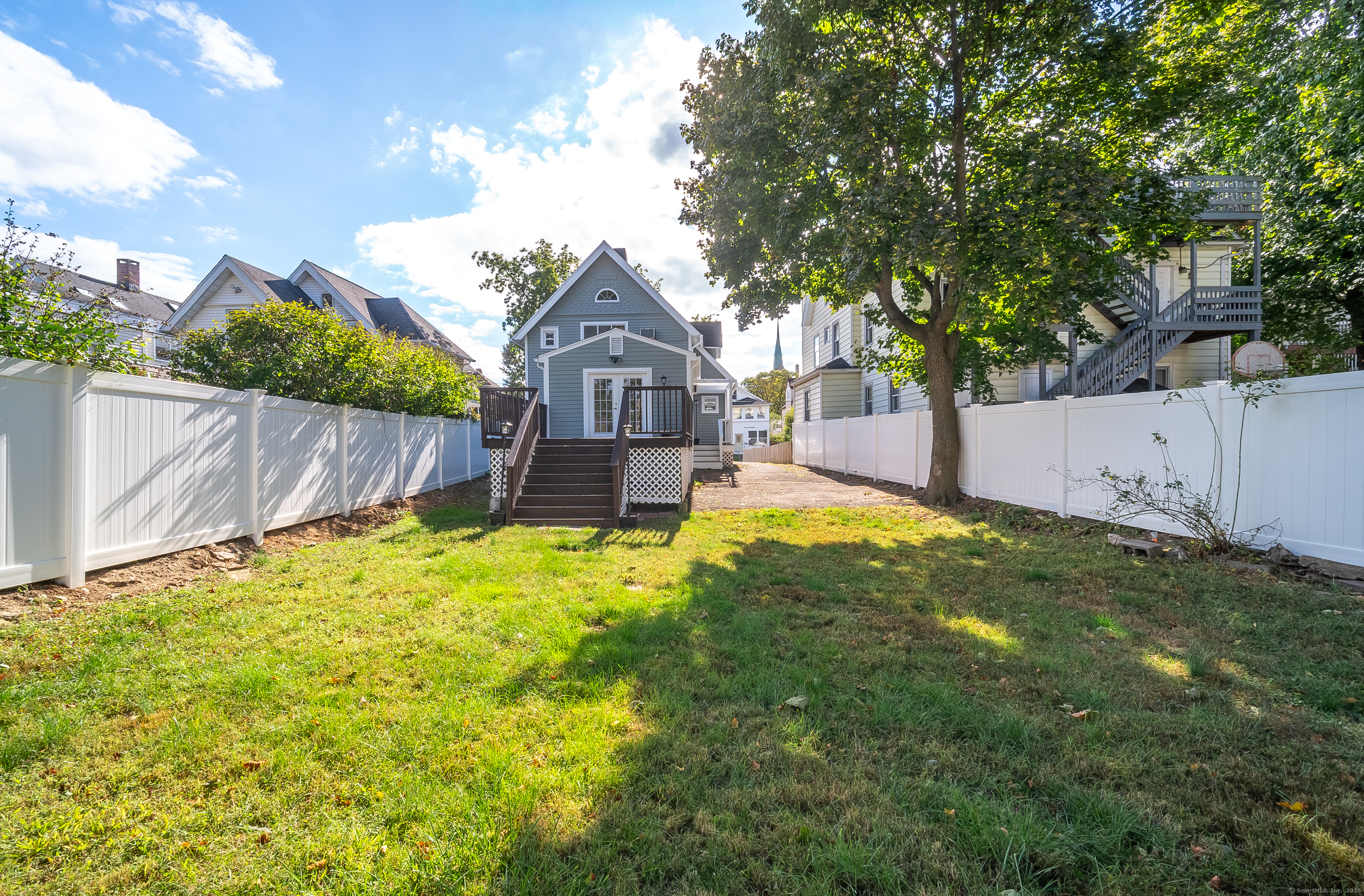 78 Warren Street Stamford, CT 06902 - Photo 36 of 40 a view of a house with a yard