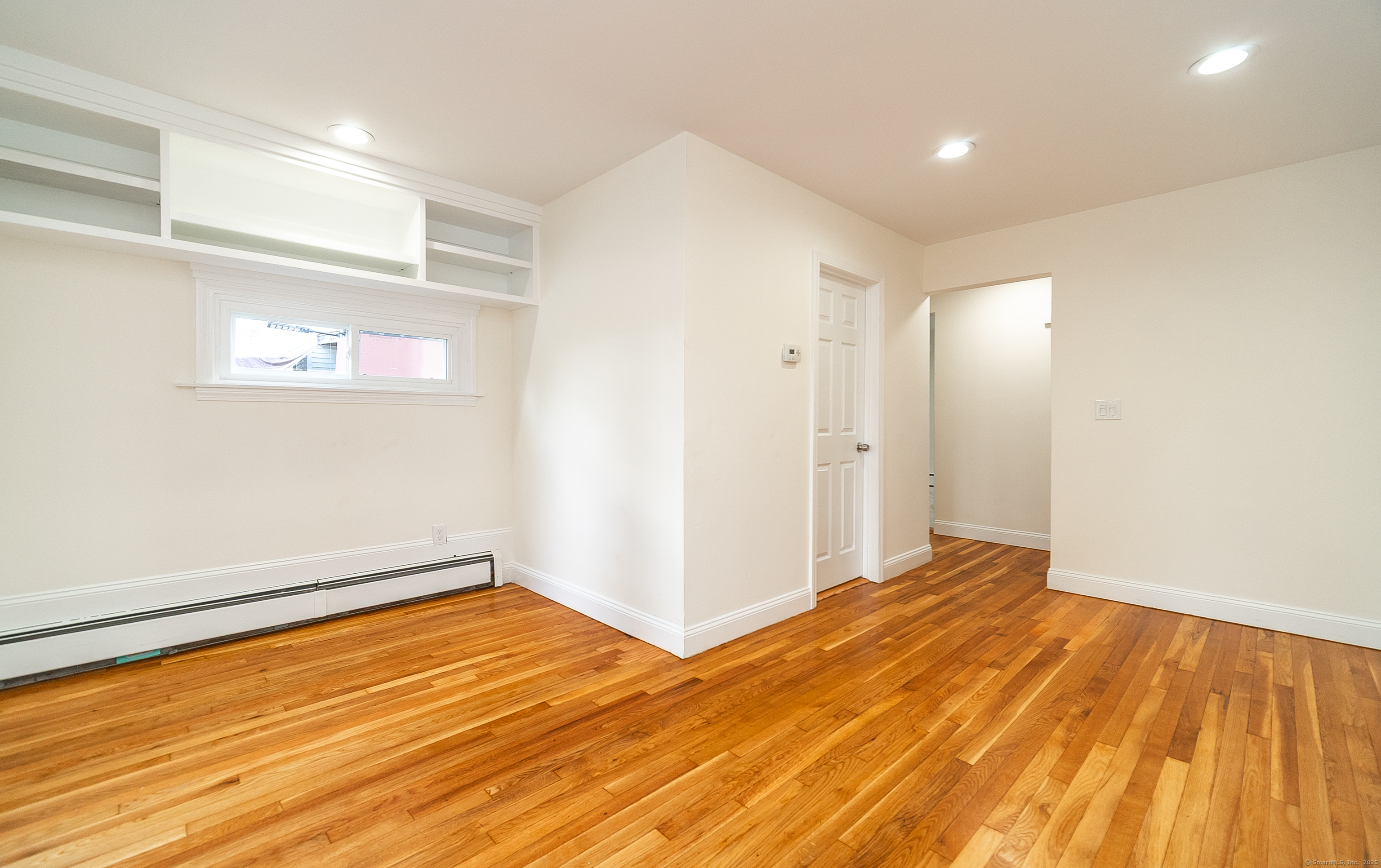 78 Warren Street Stamford, CT 06902 - Photo 9 of 40 a view of an empty room with wooden floor