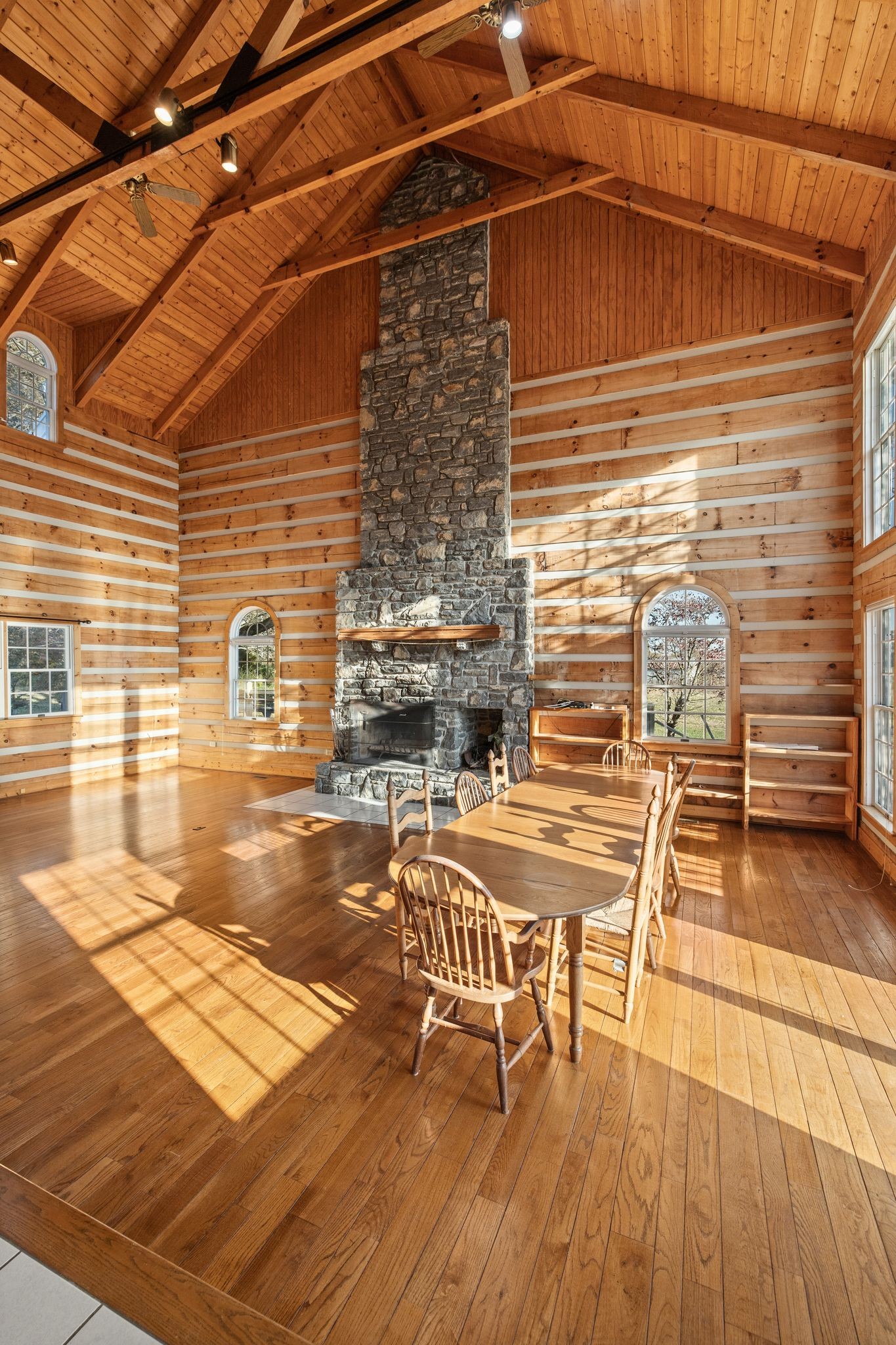 2301 Rock Creek Road Estill Springs, TN 37330 - Photo 16 of 65 a view of a patio with table and chairs with wooden floor