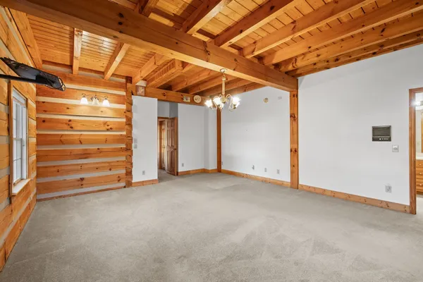 a view of room with stairs and windows
