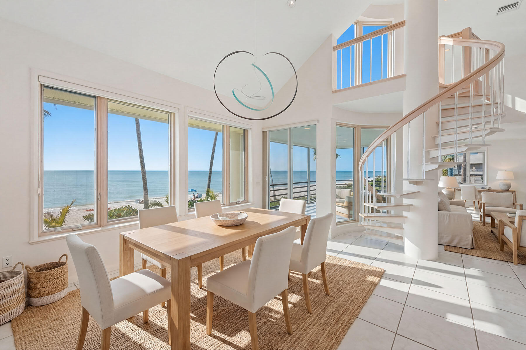 30 3rd Avenue South Naples, FL 34102 - Photo 11 of 17 a dining room with furniture a chandelier and wooden floor