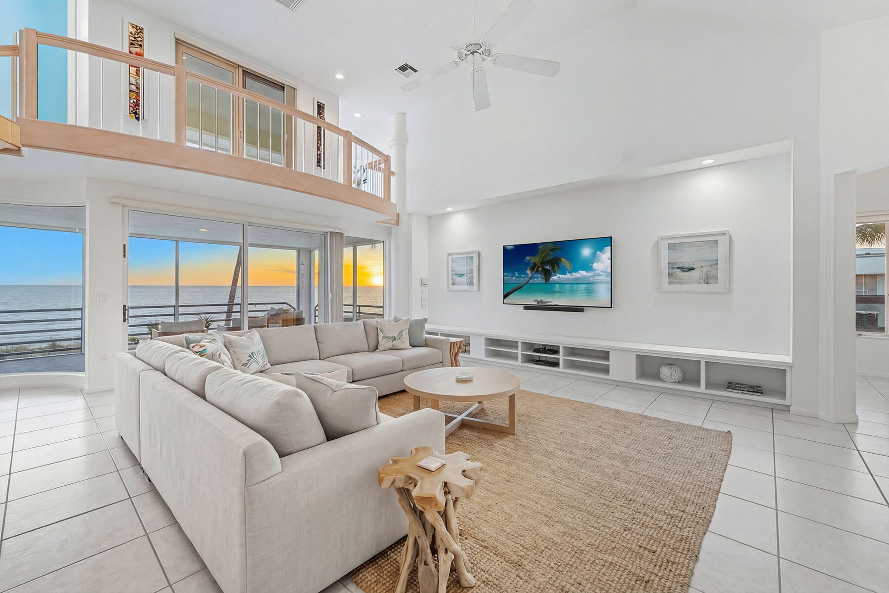 30 3rd Avenue South Naples, FL 34102 - Photo 12 of 17 a living room with furniture and a flat screen tv
