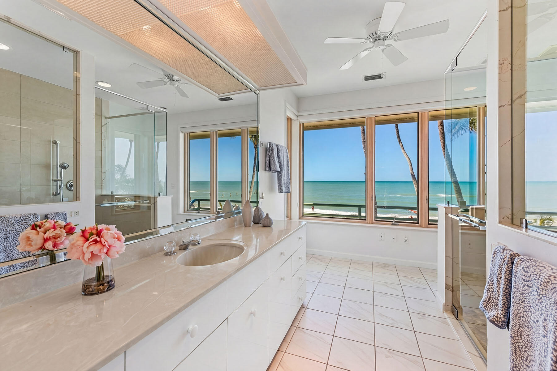 30 3rd Avenue South Naples, FL 34102 - Photo 14 of 17 a large white kitchen with a large window