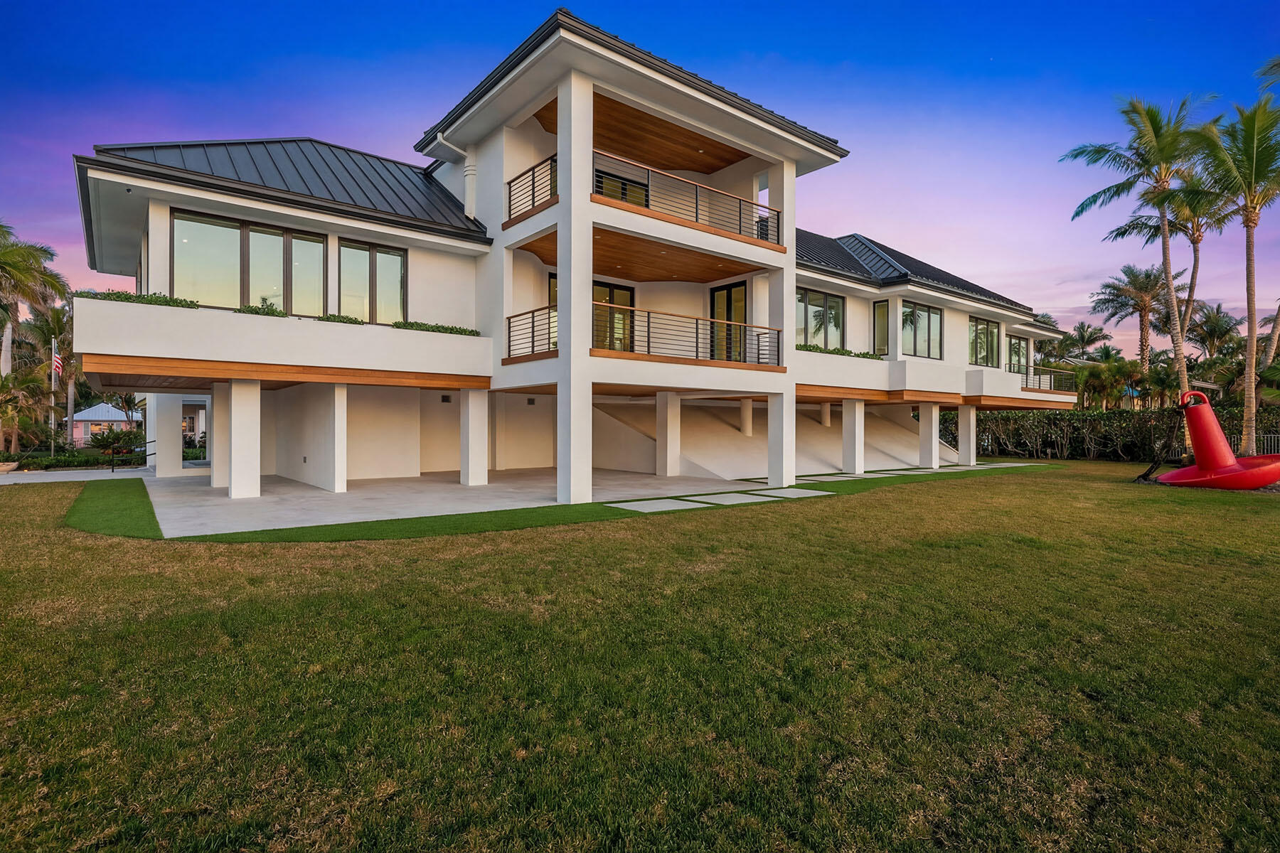 30 3rd Avenue South Naples, FL 34102 - Photo 5 of 17 a front view of a house with a yard