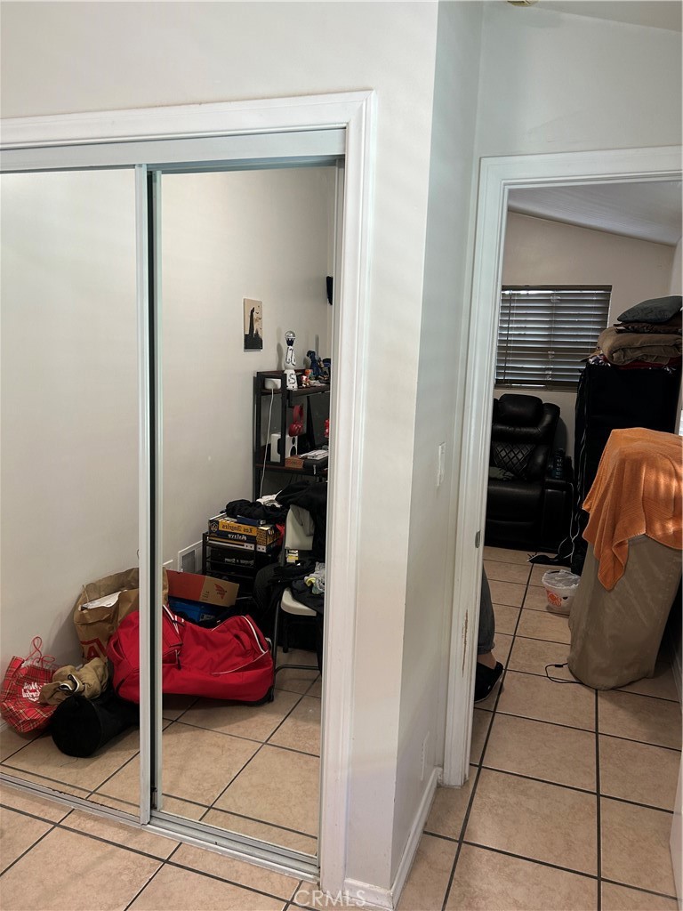 21900 Martin Street, Unit A8 Carson, CA 90745 - Photo 10 of 10 a bedroom with a bed and cabinets