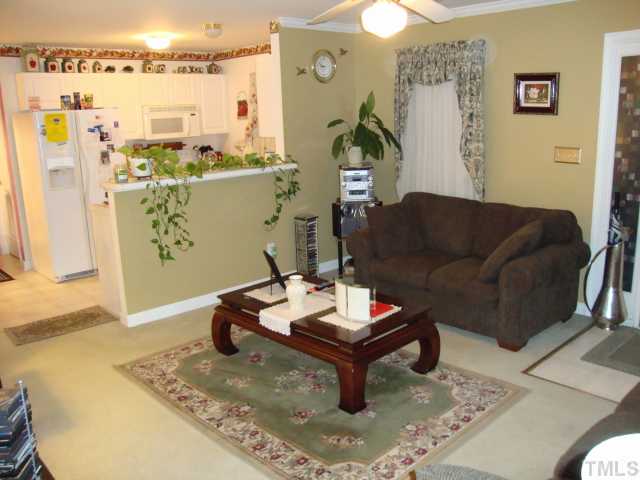 1201 Swingline Way Raleigh, NC 27610 - Photo 4 of 12 Another shot of the living area showing the transition into the kitchen. The openness of this area makes this home live much larger than 1200 square feet. In addition, the way the downstairs area is laid out is perfect for entertaining friends & family!
