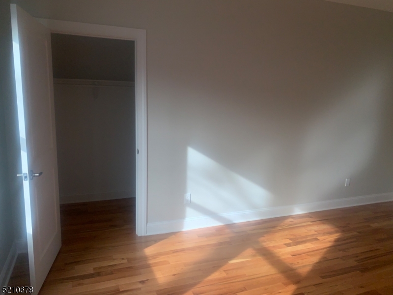 7 North Beverwyck Road, Unit B Lake Hiawatha, NJ 07034 - Photo 4 of 5 a view of a hallway with wooden floor