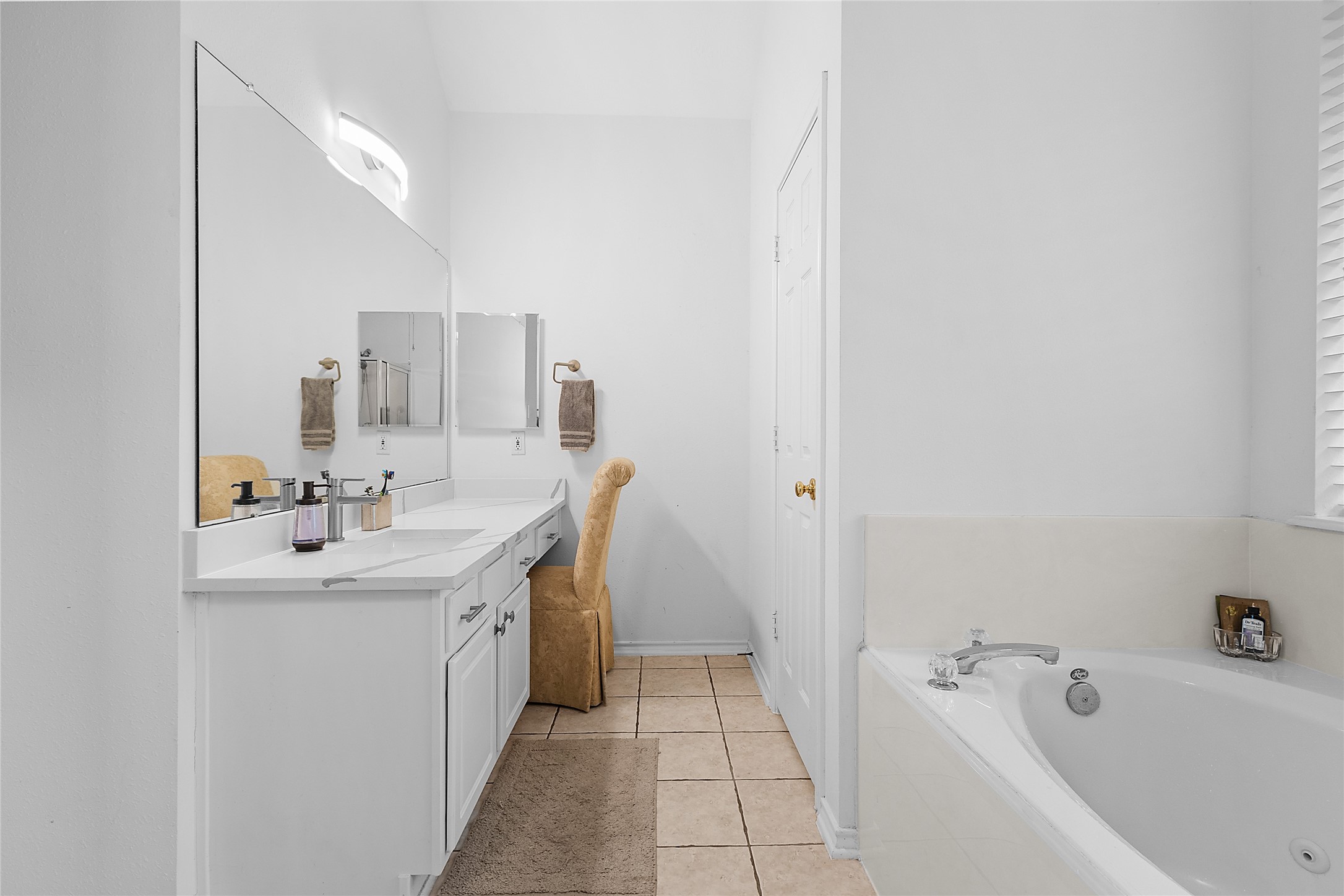 21014 Jessica Rose Lane Spring, TX 77379 - Photo 24 of 30 a bathroom with a tub sink and mirror