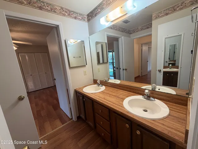 a bathroom with a sink a mirror and a toilet