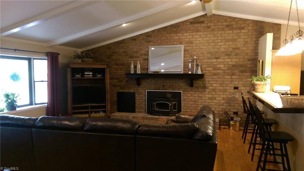 6908 Ridge Road Tobaccoville, NC 27050 - Photo 2 of 20 View of Den (living room) with fireplace