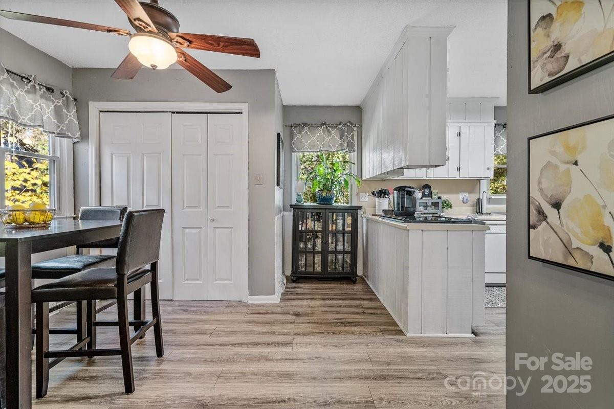 5084 Mariana Court Tega Cay, SC 29708 - Photo 11 of 33 a kitchen with a table chairs refrigerator and window