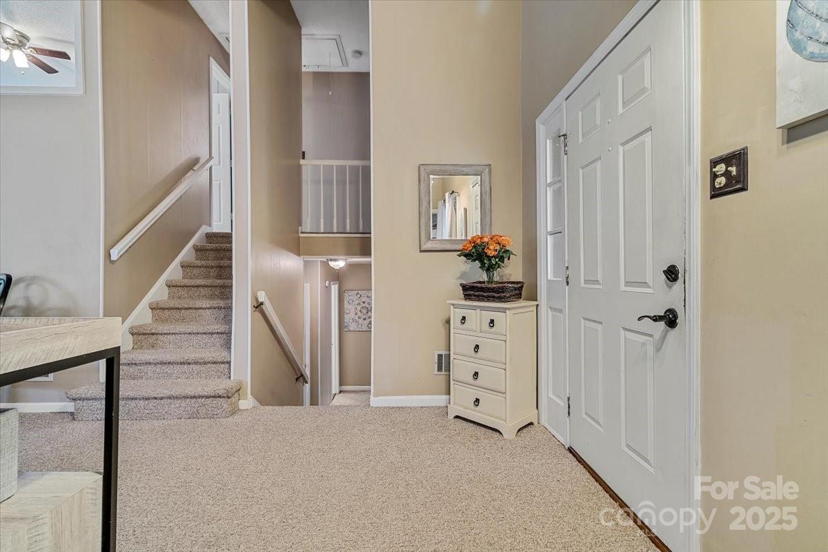 5084 Mariana Court Tega Cay, SC 29708 - Photo 12 of 33 a view of room with stairs and cabinet