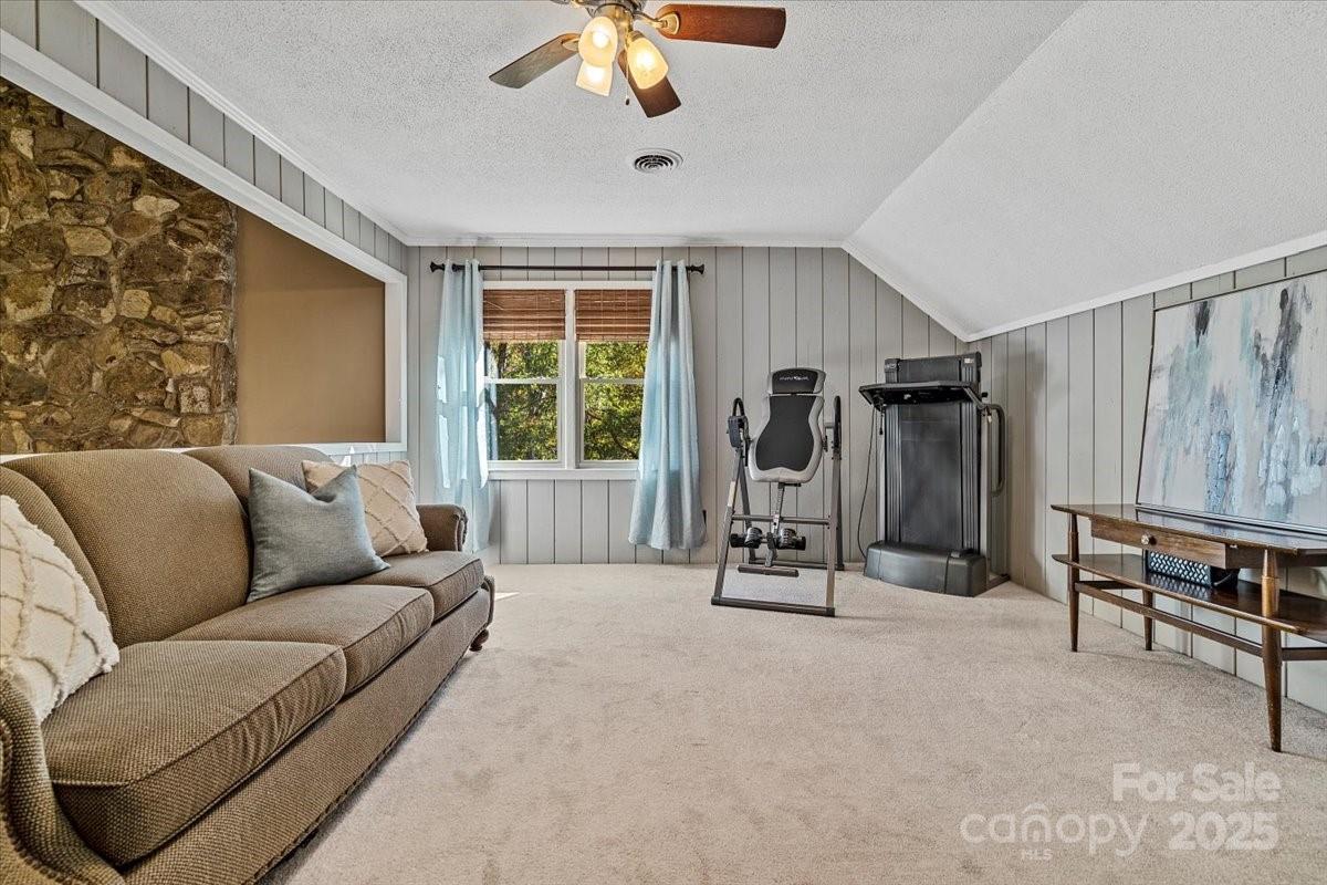 5084 Mariana Court Tega Cay, SC 29708 - Photo 13 of 33 a living room with furniture gym equipment and a window