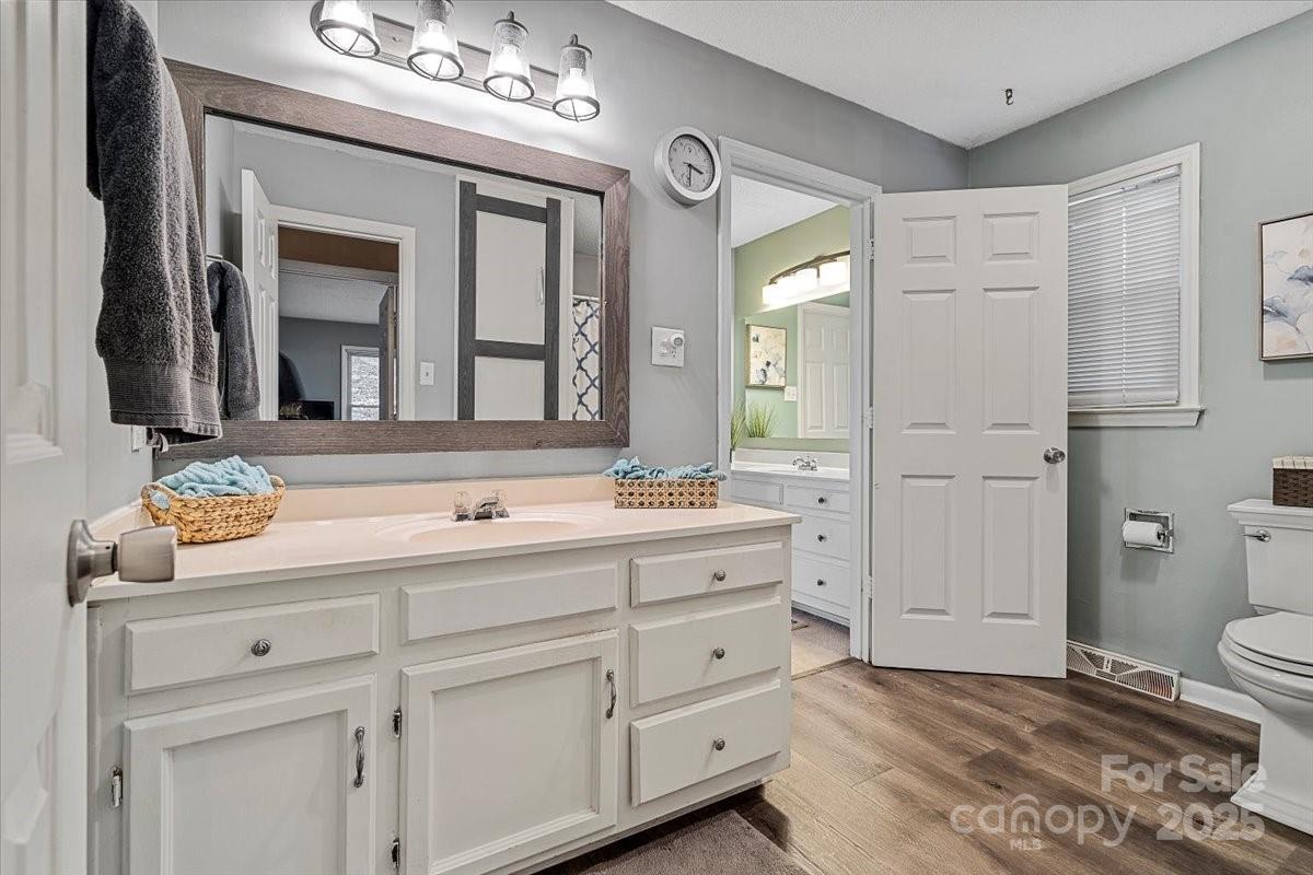 5084 Mariana Court Tega Cay, SC 29708 - Photo 20 of 33 a bathroom with a sink a toilet and a mirror