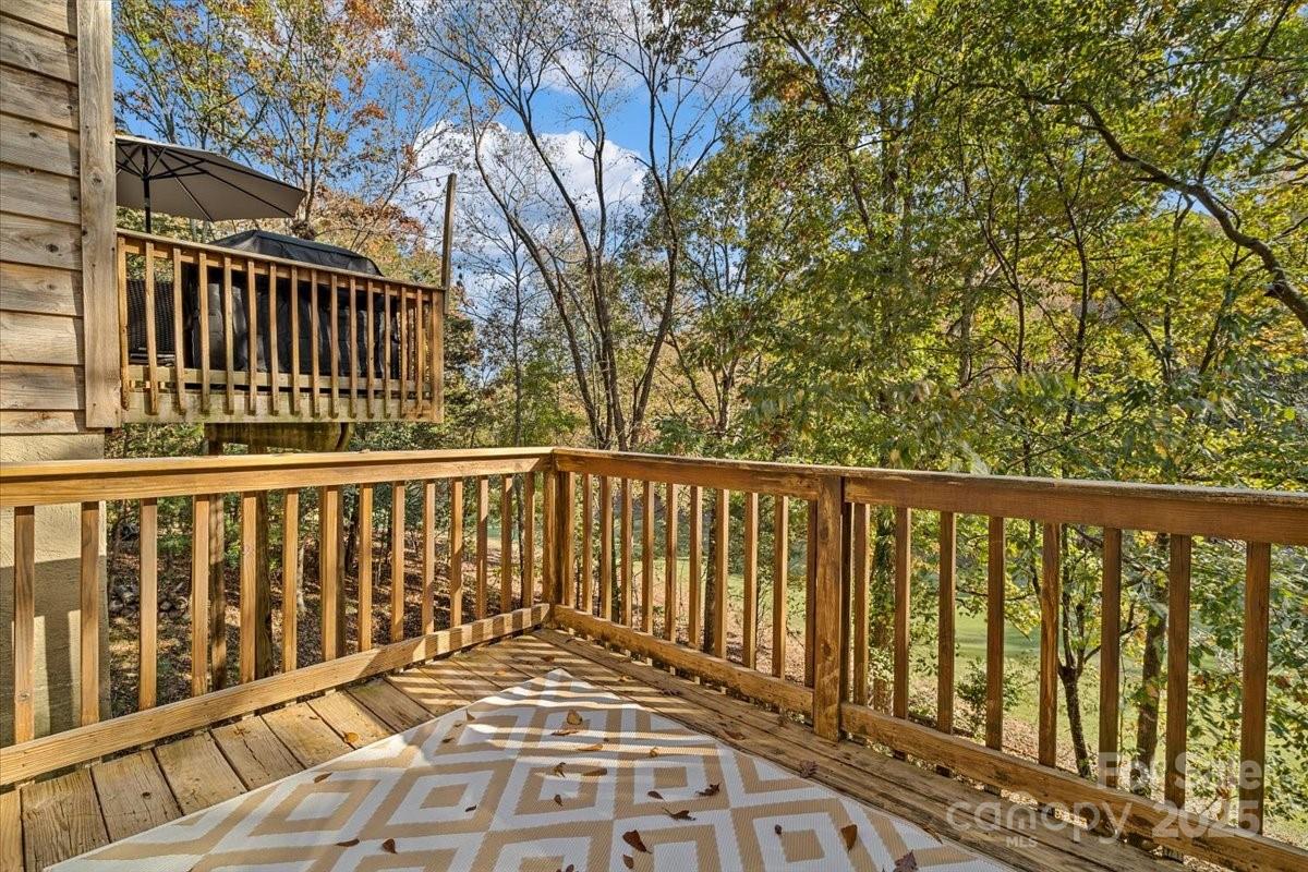 5084 Mariana Court Tega Cay, SC 29708 - Photo 23 of 33 a balcony with wooden floor and fence