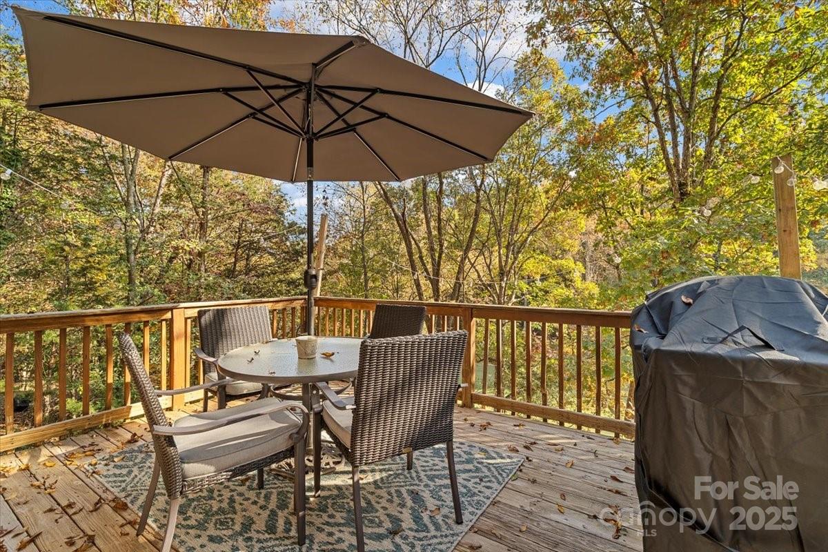 5084 Mariana Court Tega Cay, SC 29708 - Photo 24 of 33 a view of a balcony with furniture and umbrella