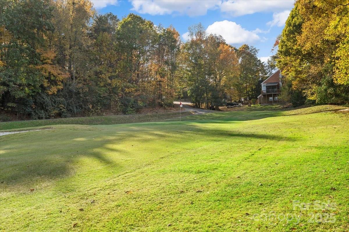 5084 Mariana Court Tega Cay, SC 29708 - Photo 27 of 33 a view of a swimming pool with an outdoor space and seating area
