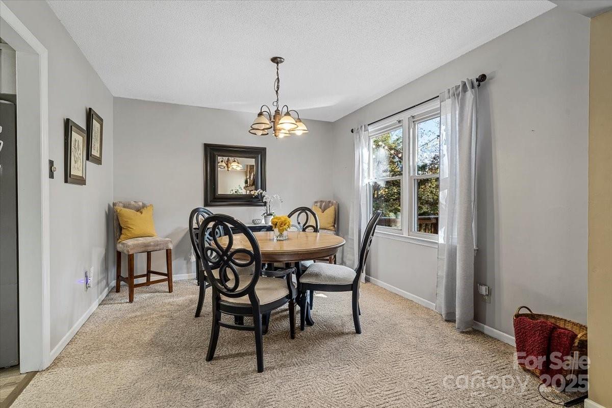 5084 Mariana Court Tega Cay, SC 29708 - Photo 6 of 33 a view of a dining room with furniture window and outside view
