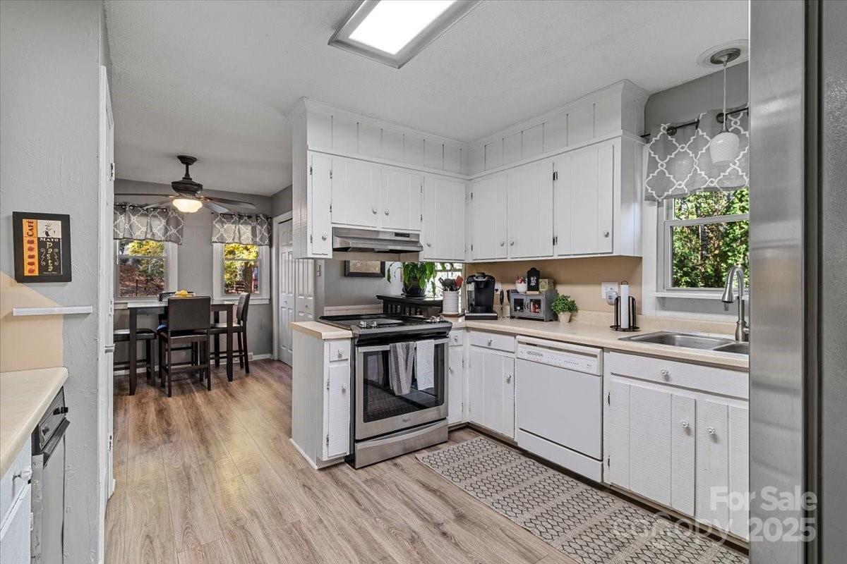 5084 Mariana Court Tega Cay, SC 29708 - Photo 7 of 33 a kitchen with stainless steel appliances granite countertop a stove a sink dishwasher and a refrigerator