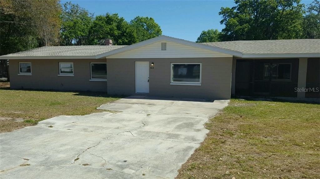 5618 Hendricks Road Lakeland, FL 33811 - Photo 1 of 1 a front view of a house with a yard
